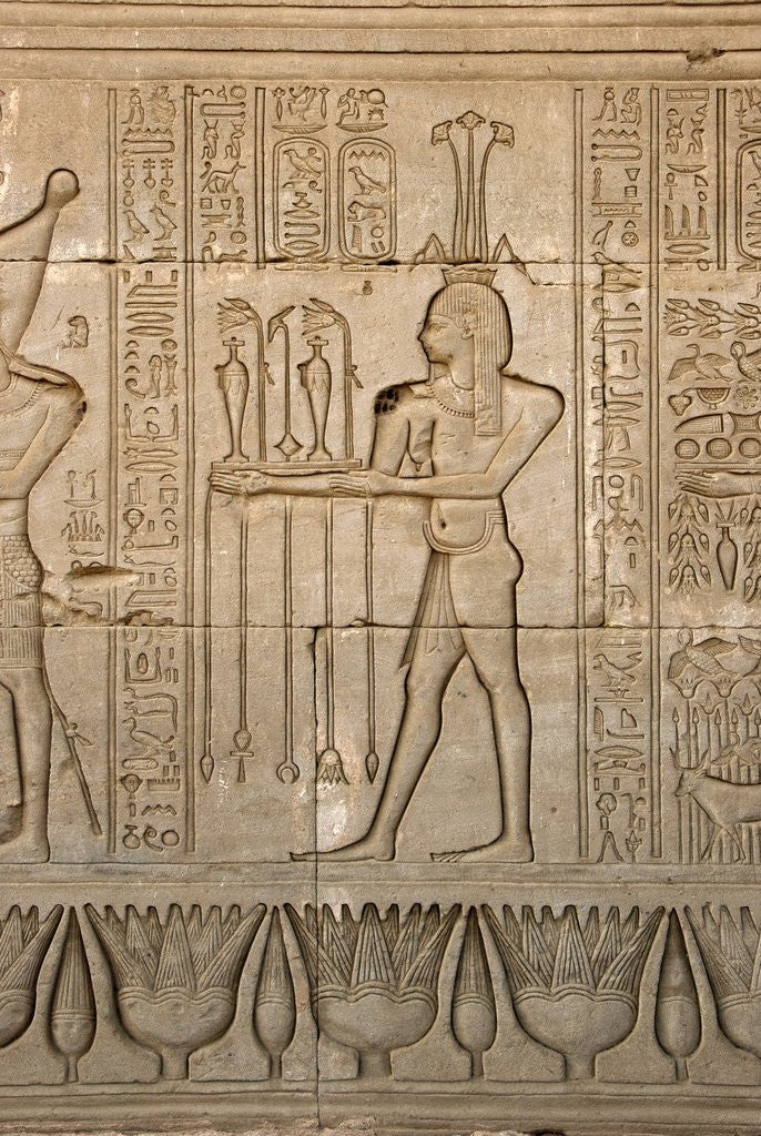 Detail of Ancient Egyptian sunken relief depicting the god of Nile, Hapy, and hieroglyphs by Corbis