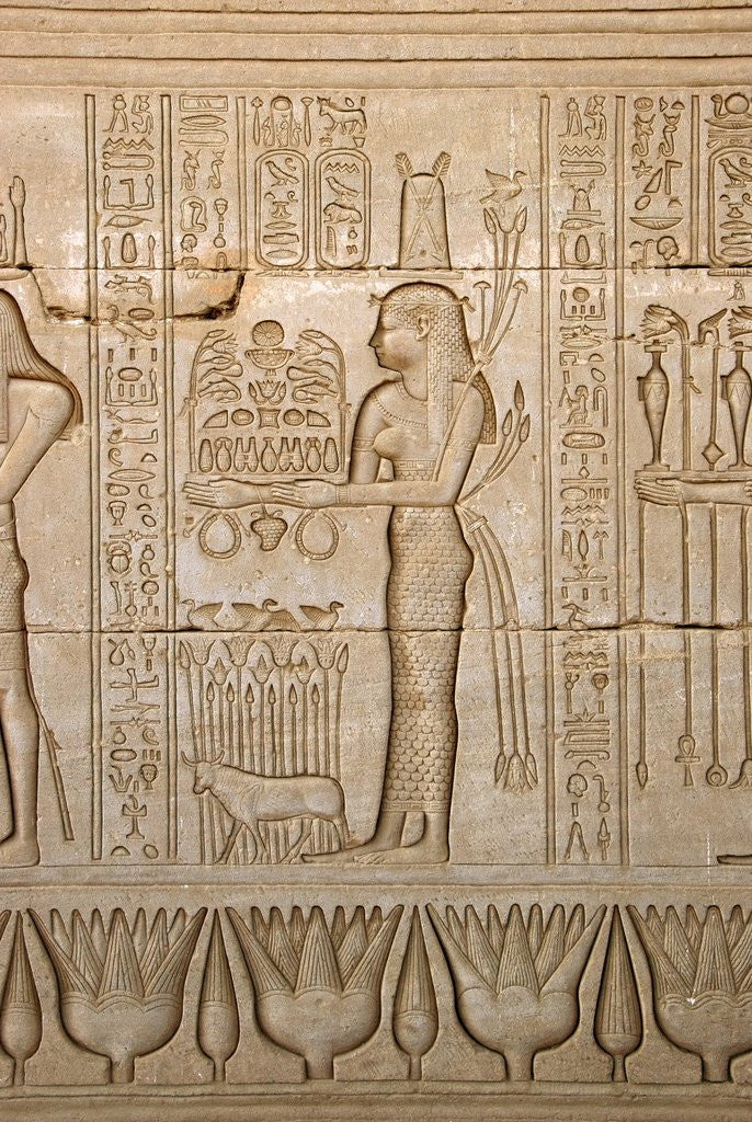 Detail of Ancient Egyptian sunken relief depicting woman bringing offerings to the goddess Hathor by Anonymous
