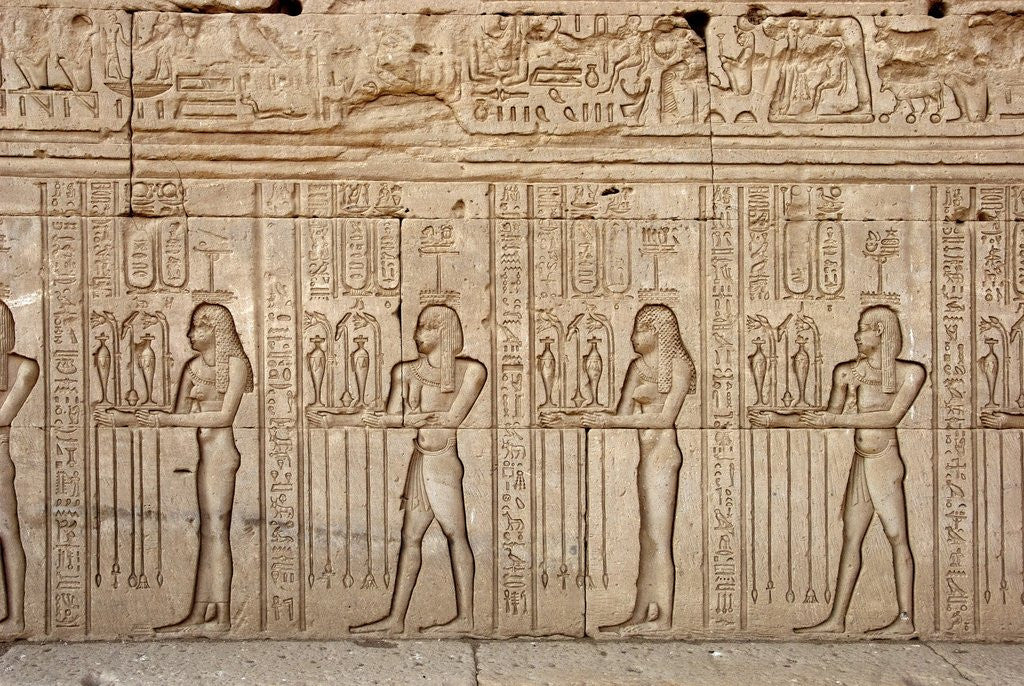 Detail of Ancient Egyptian sunken relief depicting offerings and tributes brought to the goddess Hathor by Corbis