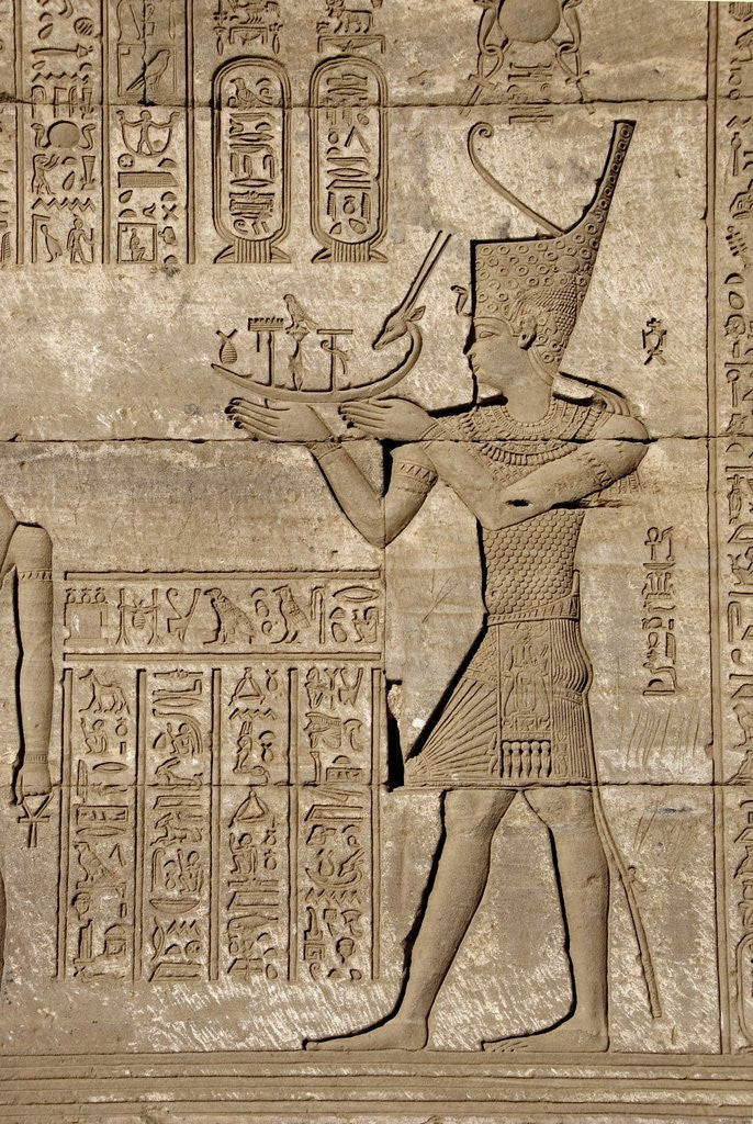 Detail of Ancient Egyptian sunken relief depicting man carrying a symbolic bark, detail of a Roman mammisi by Corbis