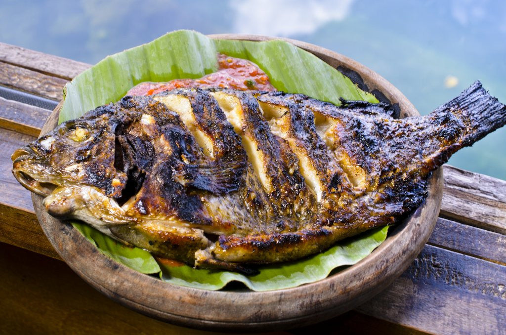 Detail of Grilled nila fish, served with banana leave by Anonymous