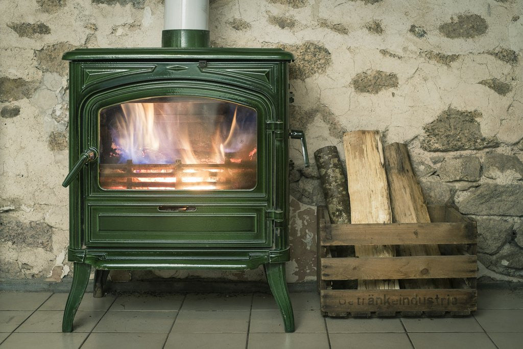 Detail of A fire in a green wood buring stove by Corbis