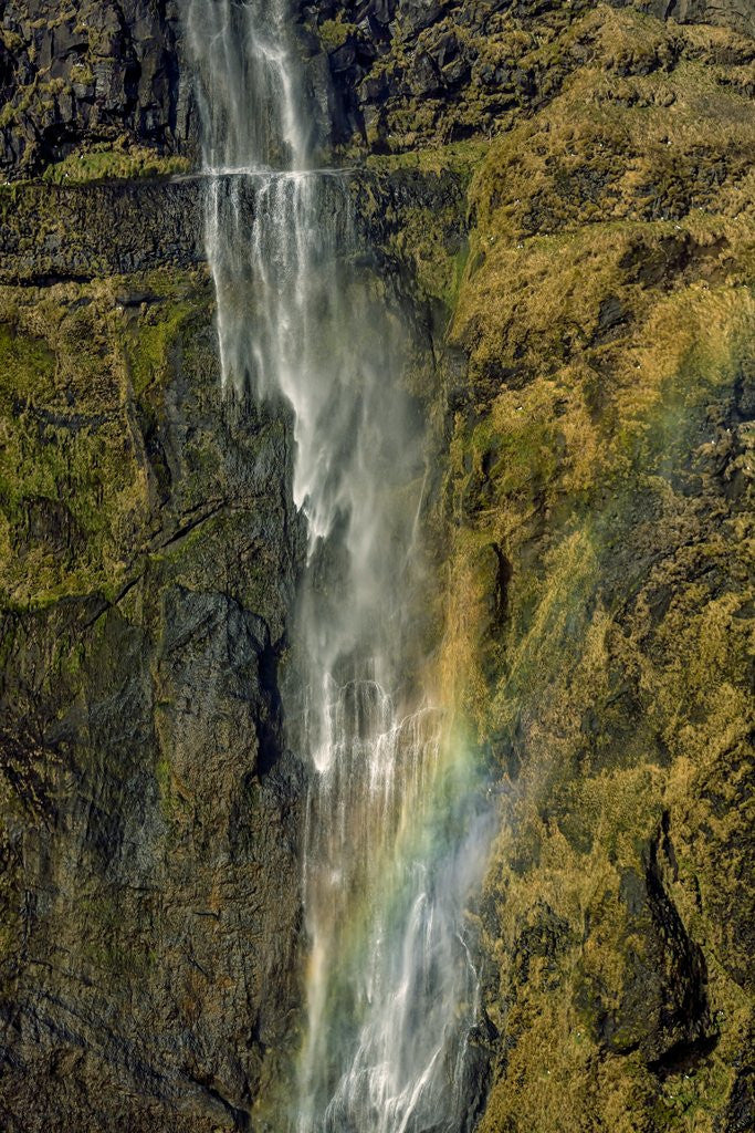 Detail of Aerial view of a waterfall and rainbow in the Eyjafjoll area, Iceland by Corbis