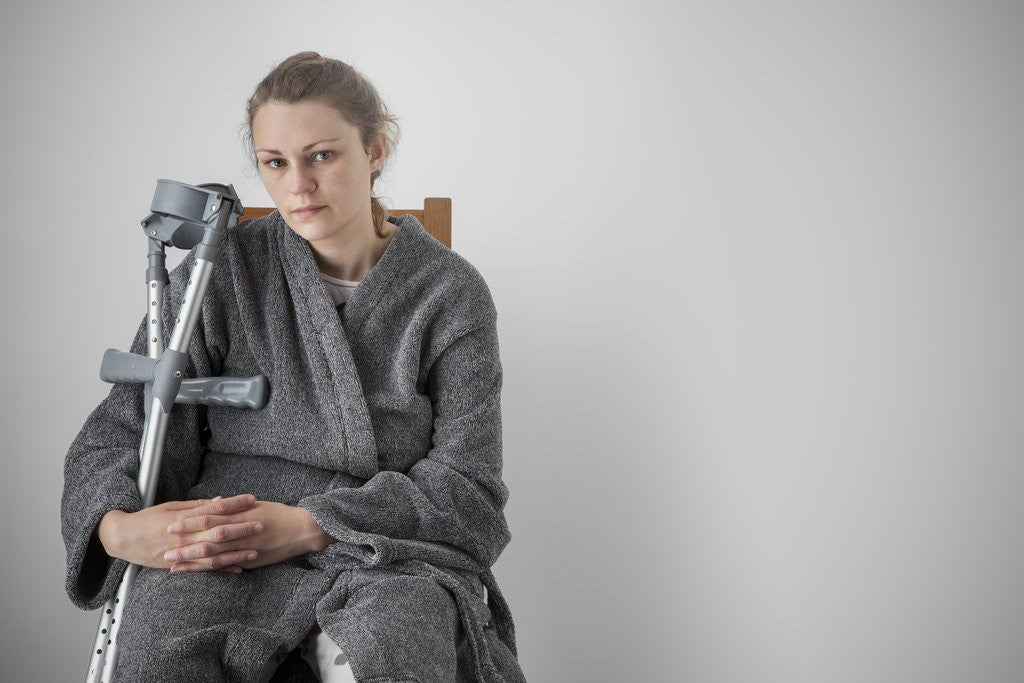 Detail of Woman seated with crutches by Anonymous