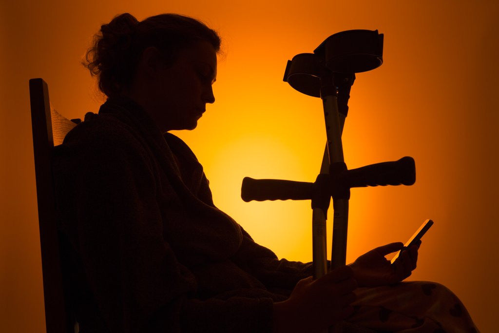 Detail of Woman seated with crutches by Anonymous