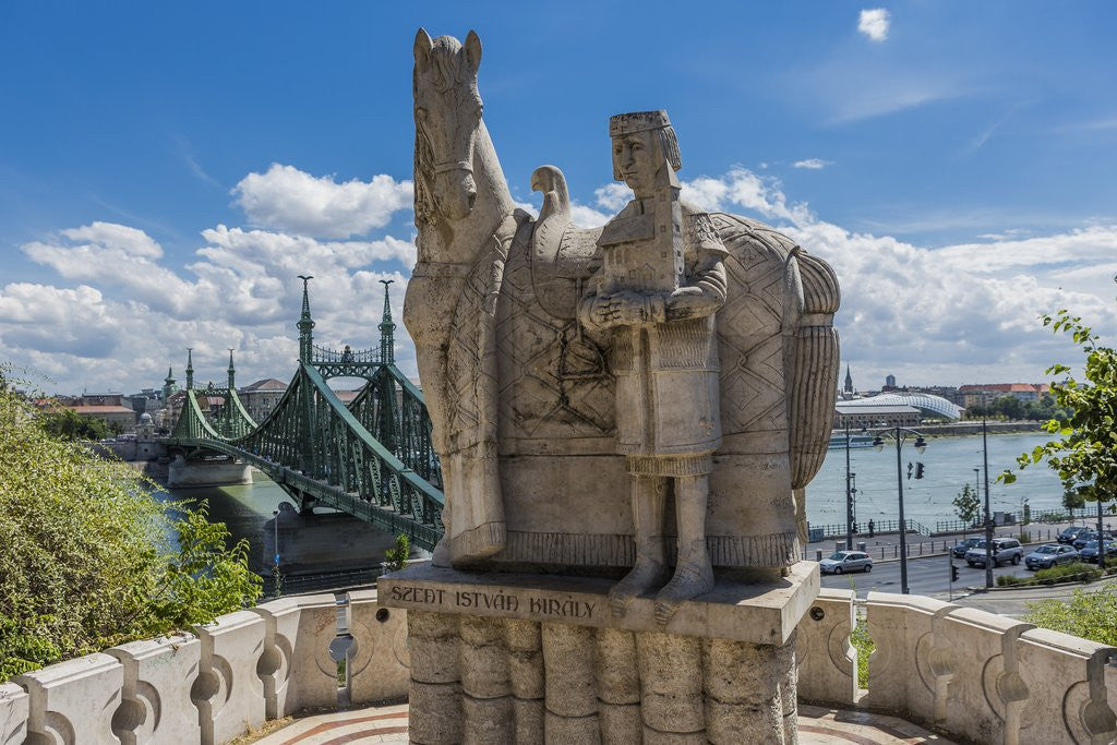 Detail of Gellert Hill), the statue of Saint Stephen near the entrance of Sziklatemplom (Church by the Rock), on the left the Szabadsag hid (Liberty Bridge or Freedom Bridge) by Anonymous
