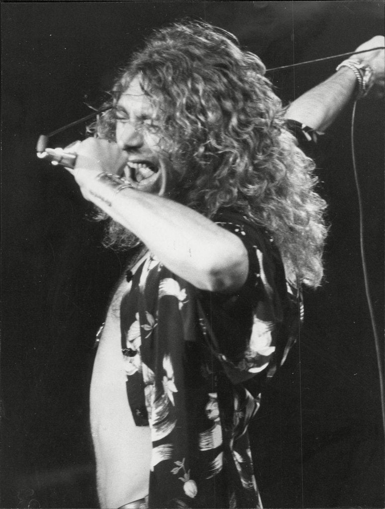 Detail of Robert Plant of Led Zeppelin on stage by Associated Newspapers