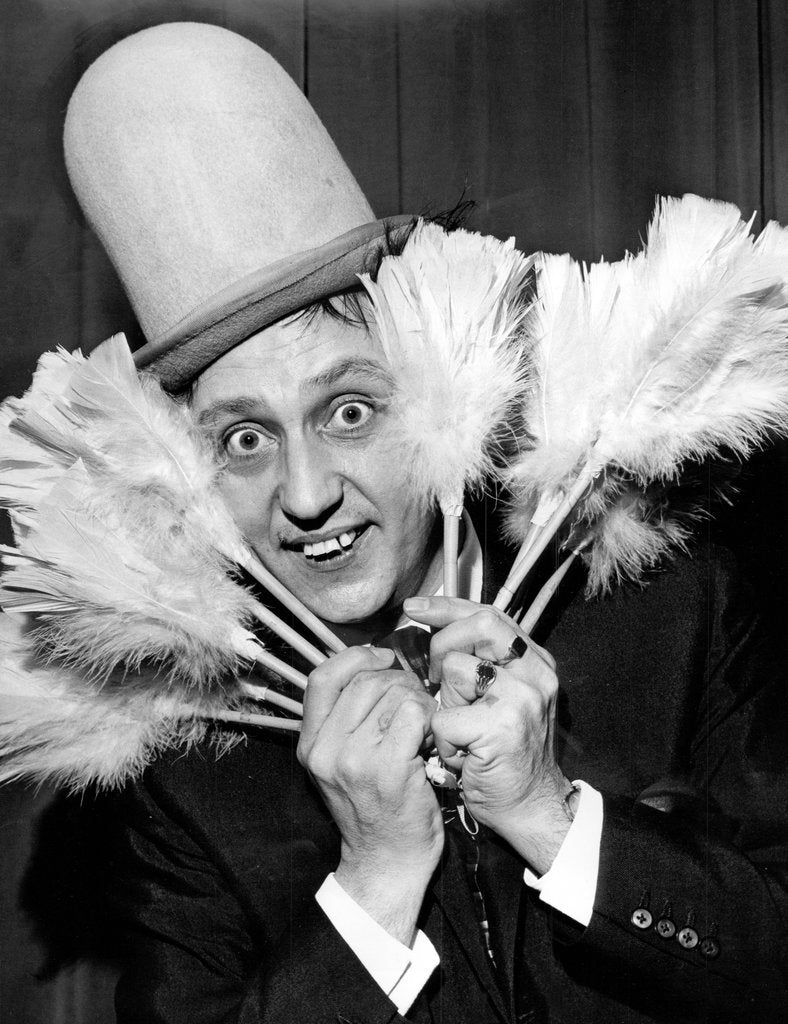 Detail of Ken Dodd with his tickling sticks by Associated Newspapers