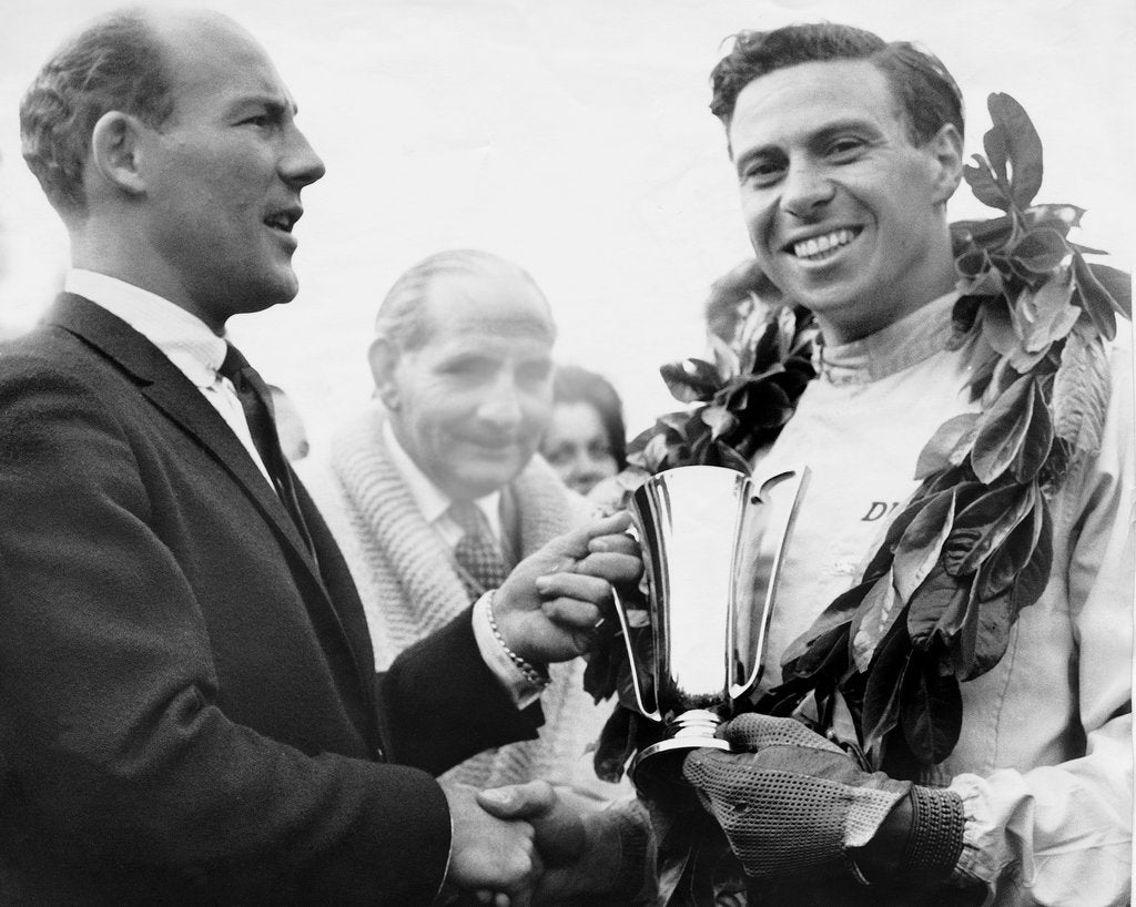 Detail of British racing drivers Jim Clark and Stirling Moss by Associated Newspapers