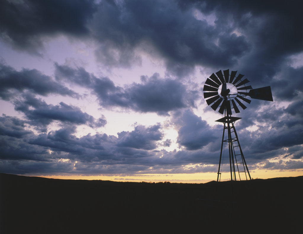 Detail of Windmill Silhouette Under Broken Clouds by Anonymous