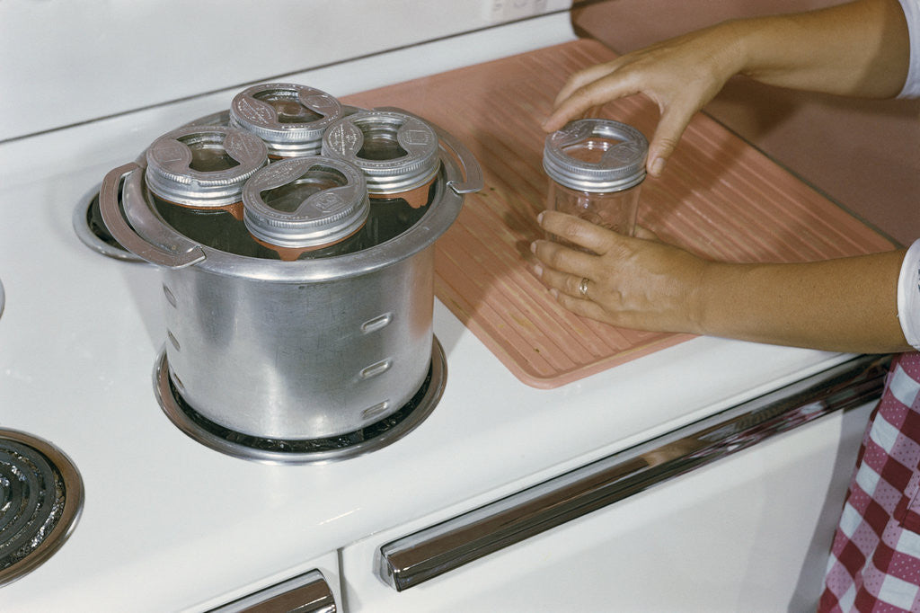 Detail of Woman Sterilizing Jars for Canning by Anonymous