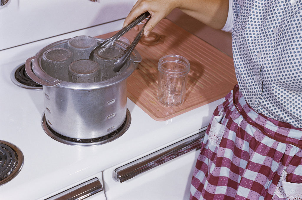 Detail of Woman Sterilizing Jars for Canning by Anonymous