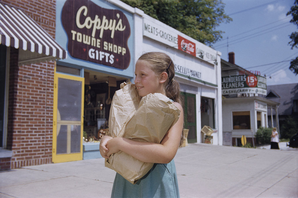 Detail of Girl Carrying Paper Shopping Bags by Anonymous