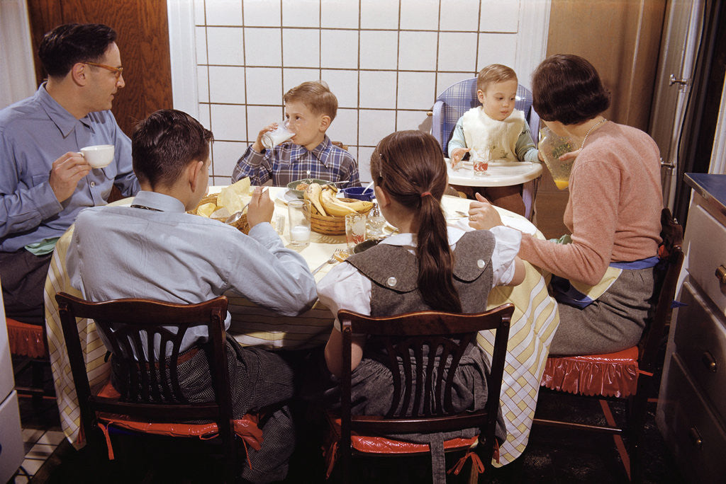 Detail of Family Eating Together at Dinner Table by Anonymous