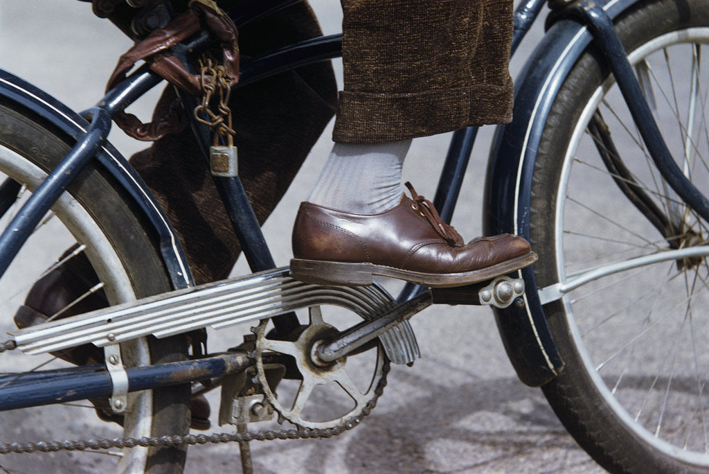 Detail of Man Riding Bicycle in Dress Shoes by Anonymous