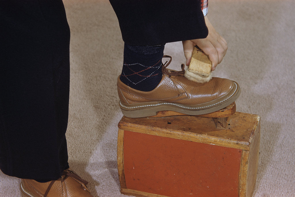 Detail of Man Buffing His Shoes by Corbis