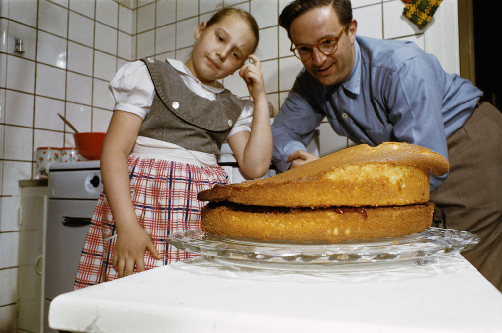 Detail of Father and Daughter Looking at Fallen Cake by Corbis