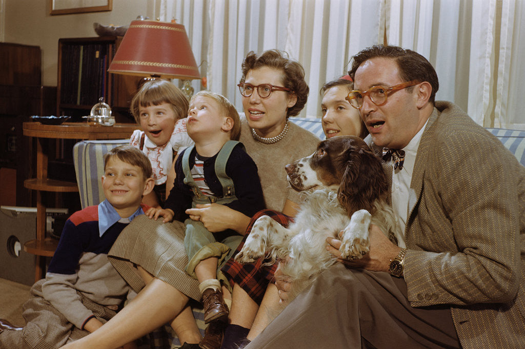 Detail of Family Sitting on Couch Together by Anonymous
