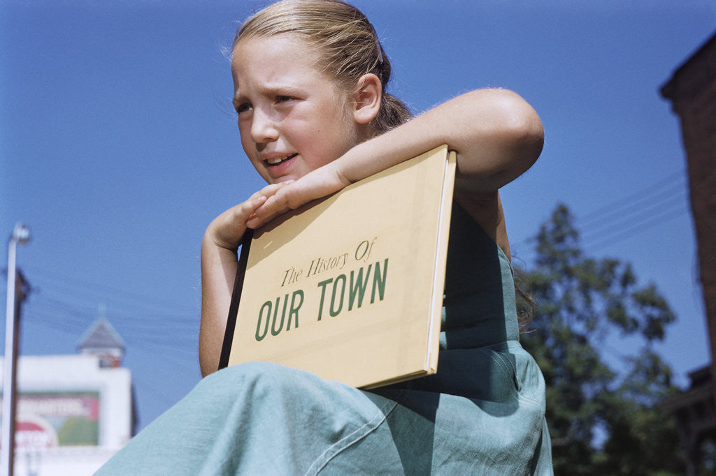 Detail of Girl Holding Town History Book by Anonymous