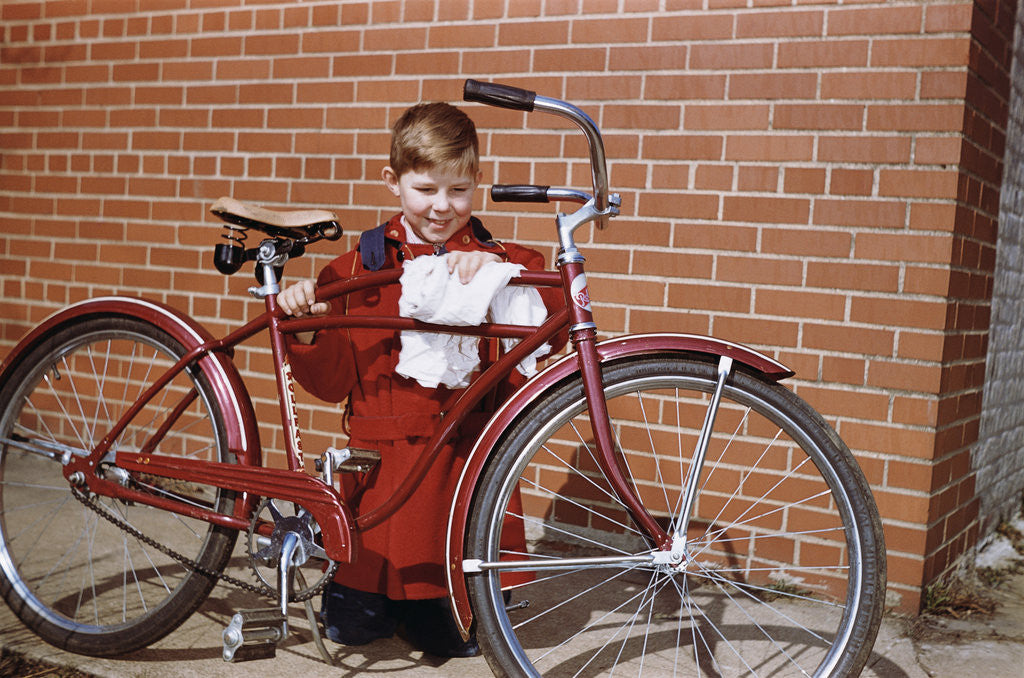 Detail of Boy Cleaning His Bike by Corbis