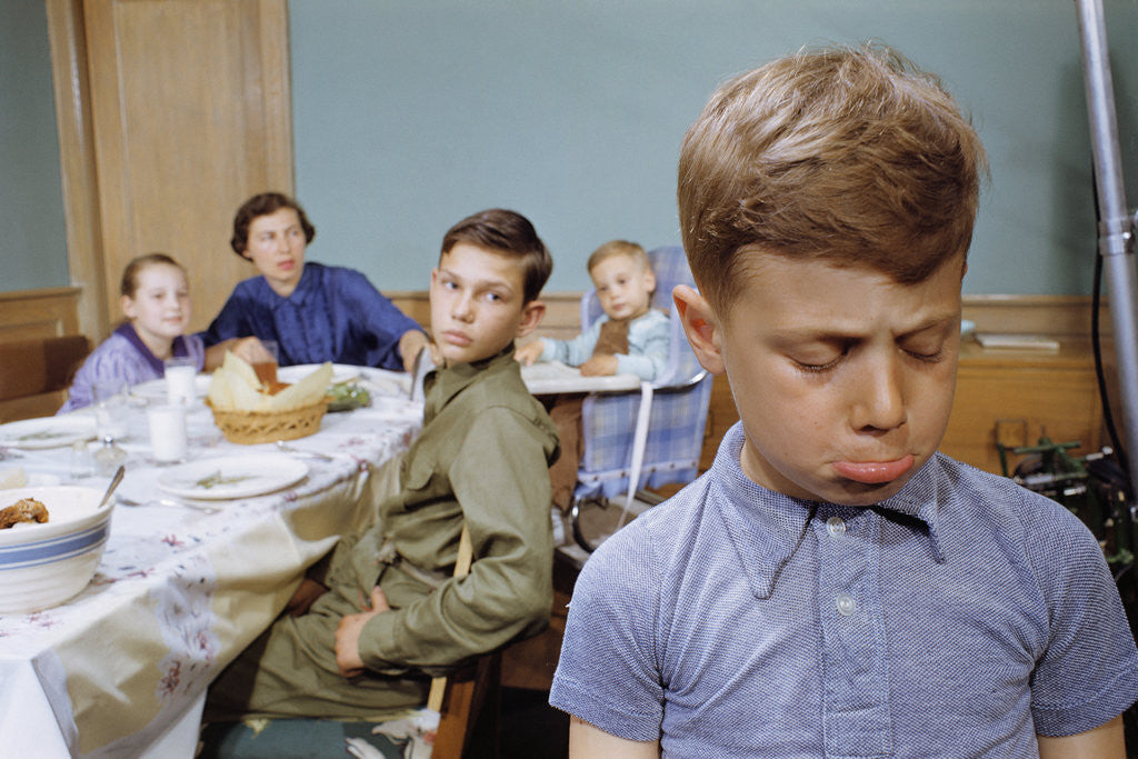 Detail of Boy Pouting near the Dinner Table by Anonymous