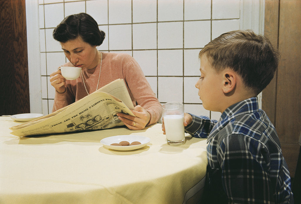 Detail of Boy Eating Cookies and Milk as Mom Reads by Anonymous