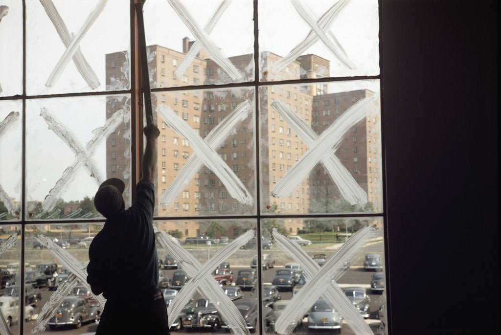 Detail of Man Cleaning Windows near Housing Project by Anonymous