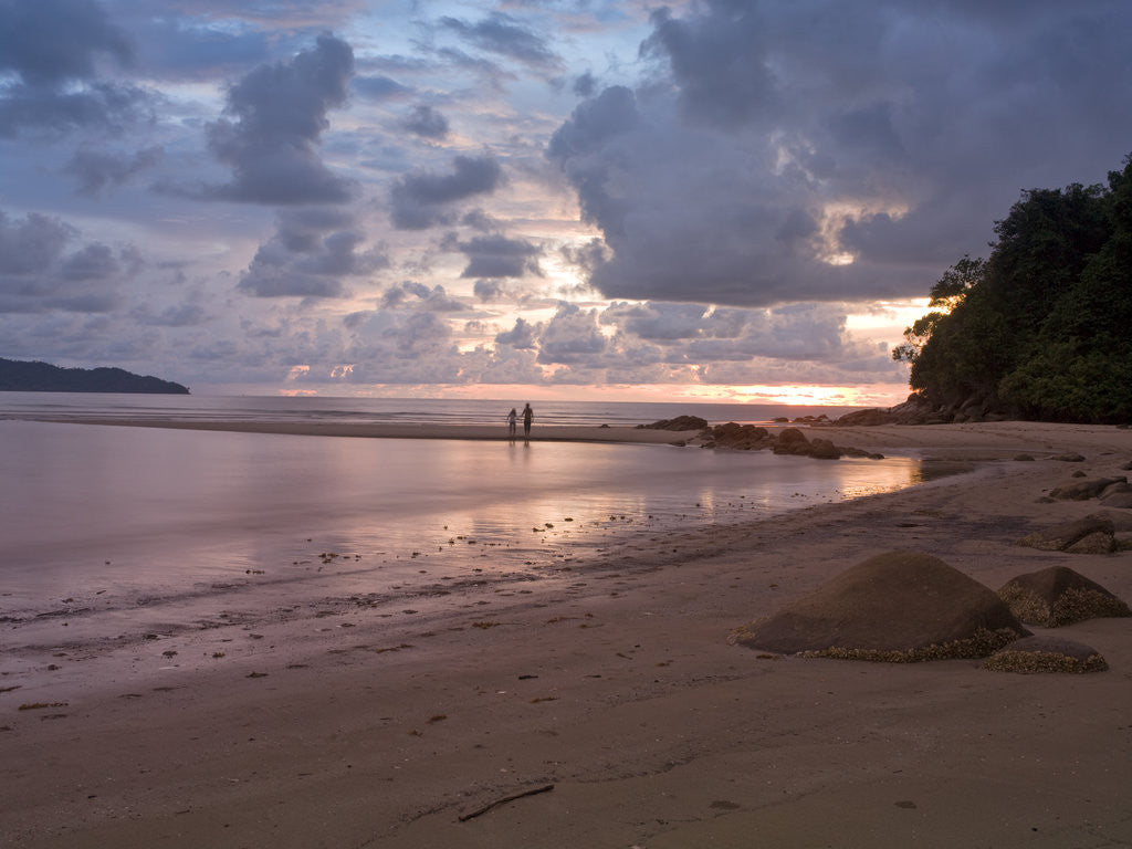 Stones on beach at dusk, Malaysia by Assaf Frank