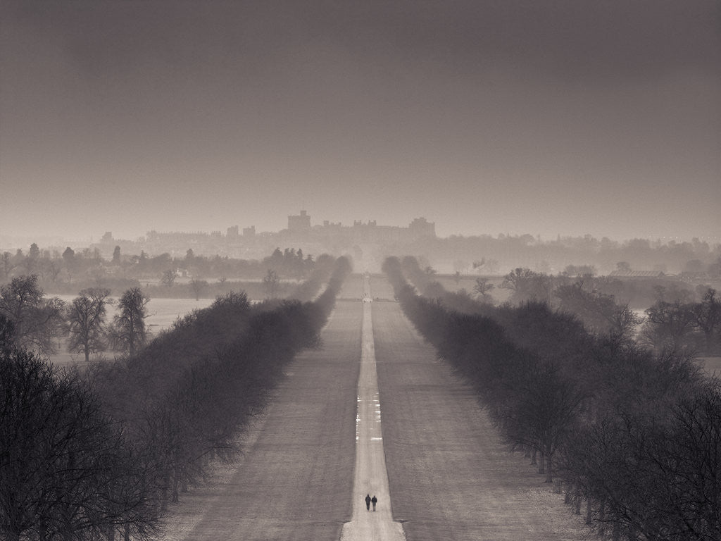 Detail of England, Berkshire, Aerial view of two people walking on long path with windsor castle in background by Assaf Frank