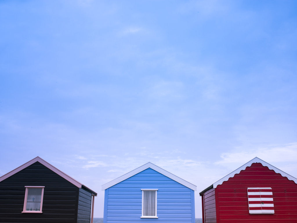 Detail of Beach huts in a row against sky by Assaf Frank