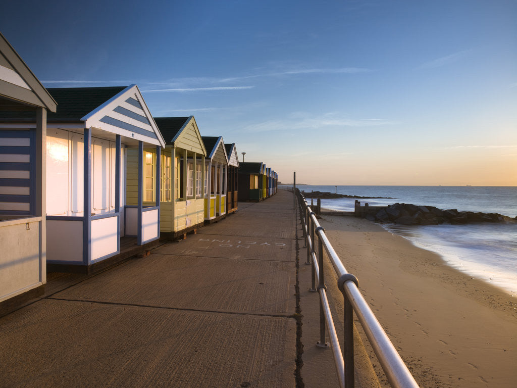 Detail of Beach huts in a row at sunrise by Assaf Frank