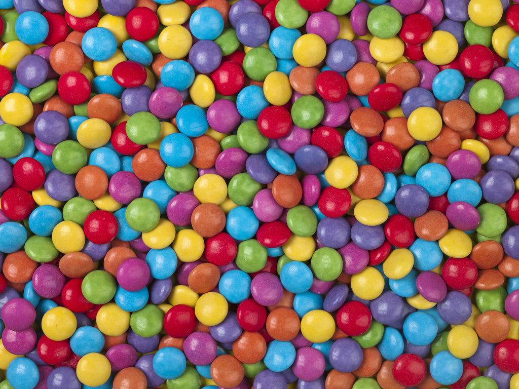 Multi colored smarties sweets by Assaf Frank