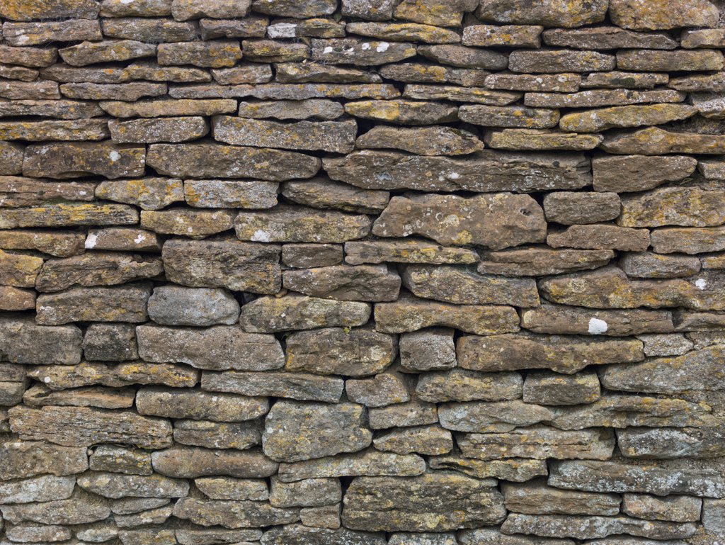 Detail of Stone wall background by Assaf Frank
