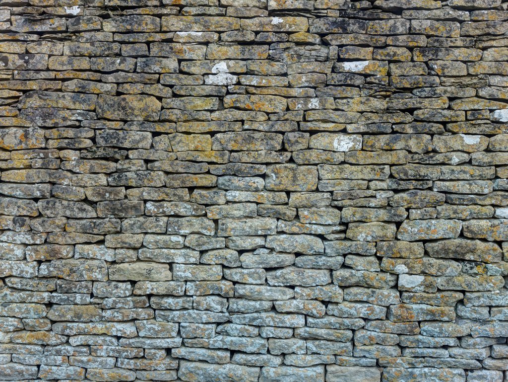 Detail of Old rustic stone wall by Assaf Frank
