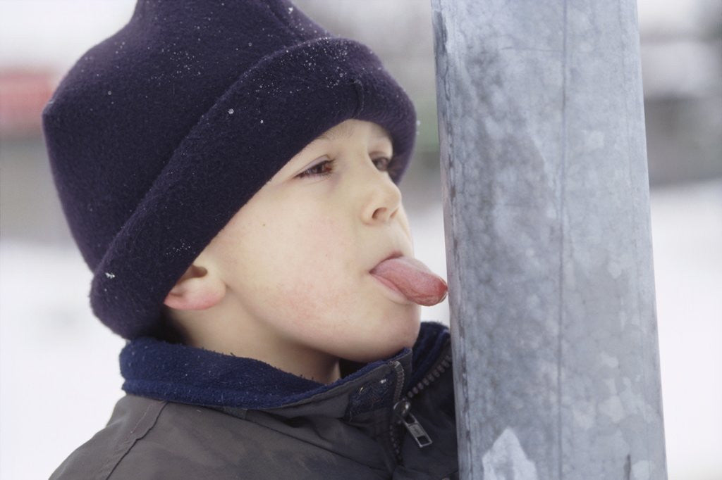 Detail of Boy Putting Tongue to Frozen Pole by Corbis