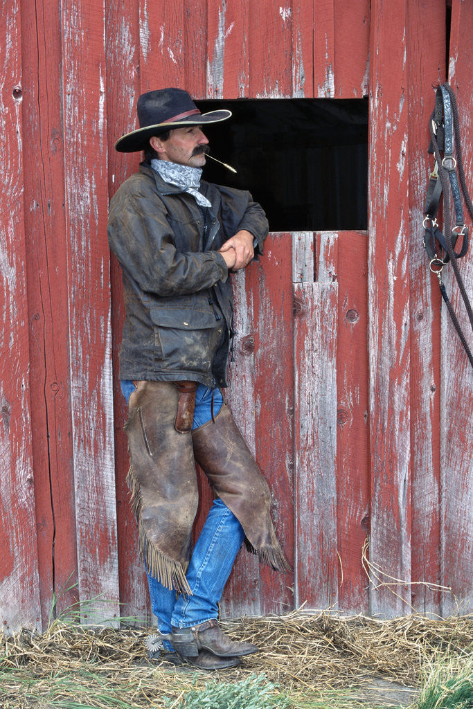 Detail of Cowboy Waiting at Barn by Corbis