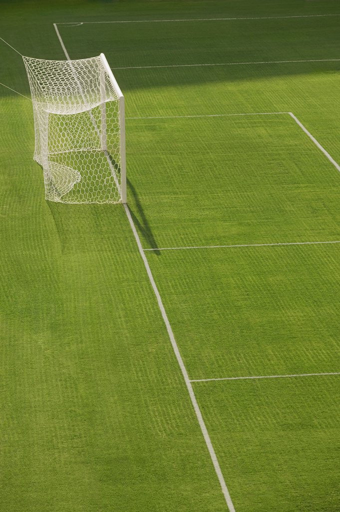Detail of Goal and Net on Empty Soccer Field by Corbis