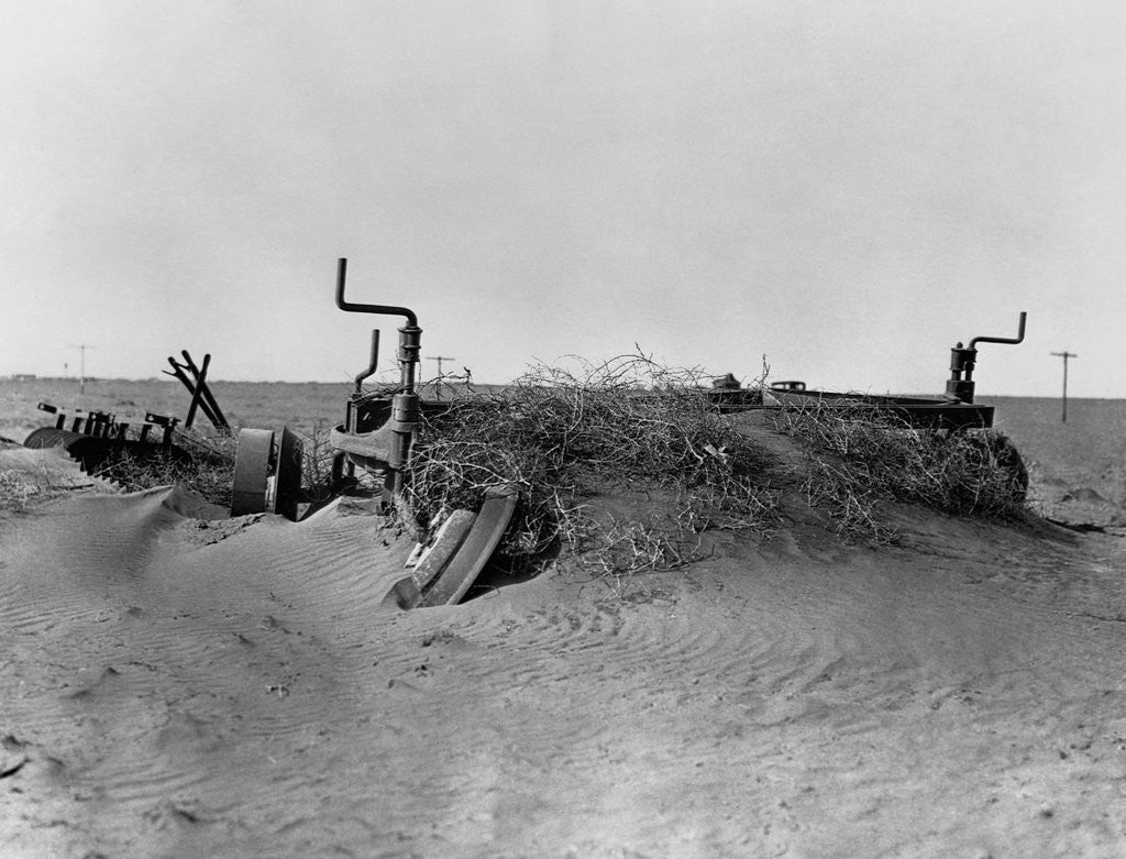 Detail of Farm Machinery Buried in Sand by Corbis