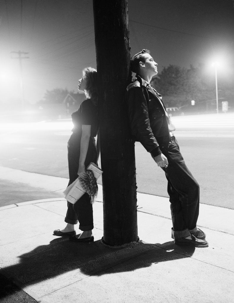 Detail of Teenagers Leaning on Utility Pole by Anonymous