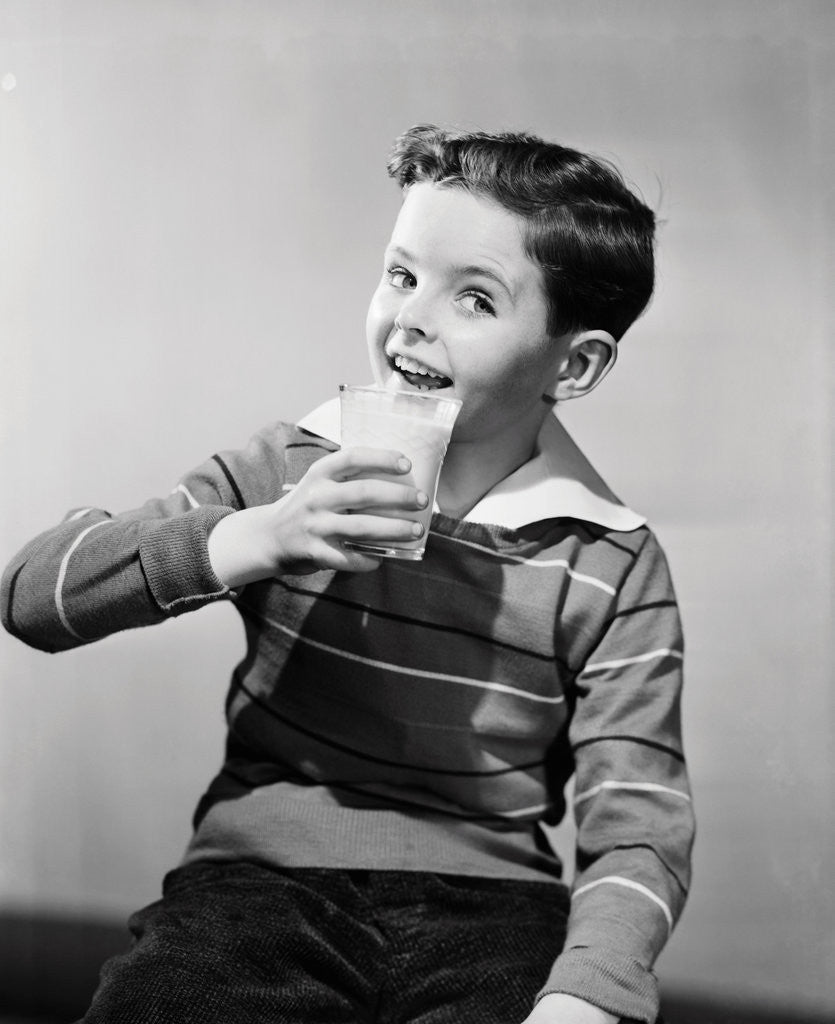Detail of Smiling Boy with a Glass of Milk by Corbis