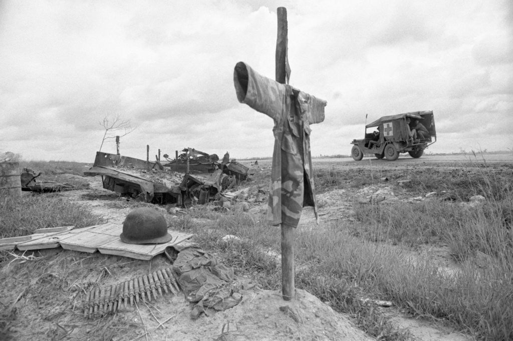 Detail of Ambulance Driving By Grave With Cross by Anonymous