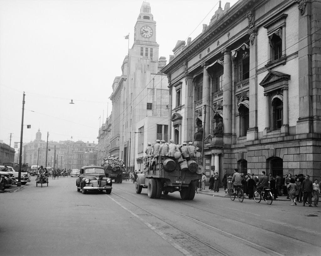 Detail of Truckloads Of Troops On City Street by Anonymous