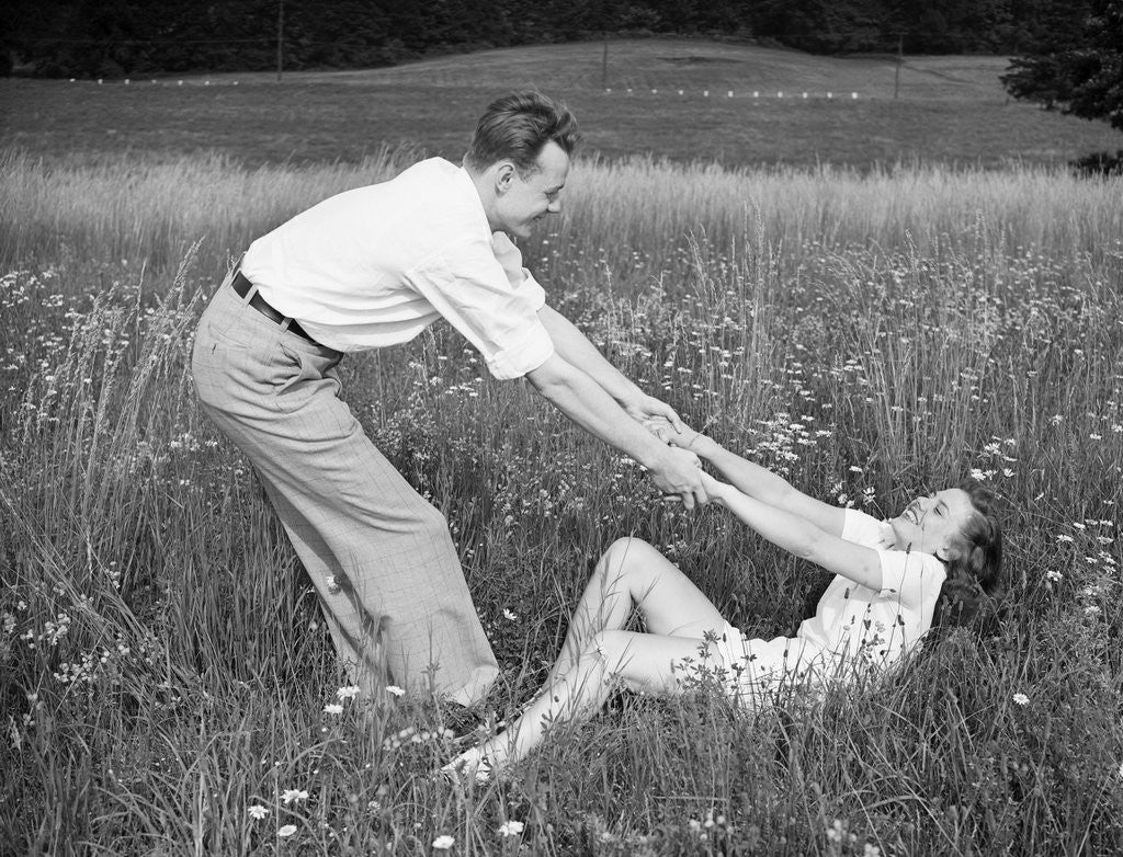 Detail of Young Couple Frolicking in Grass by Anonymous
