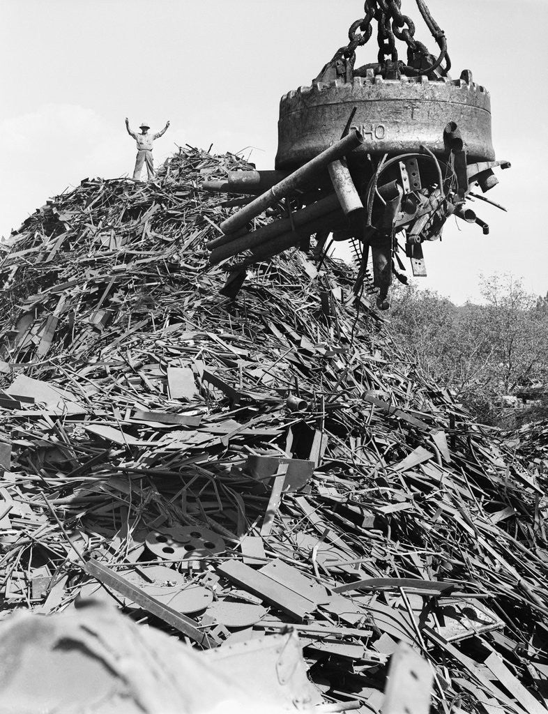 Detail of Huge Magnet Picking Up Scrap Metal by Anonymous