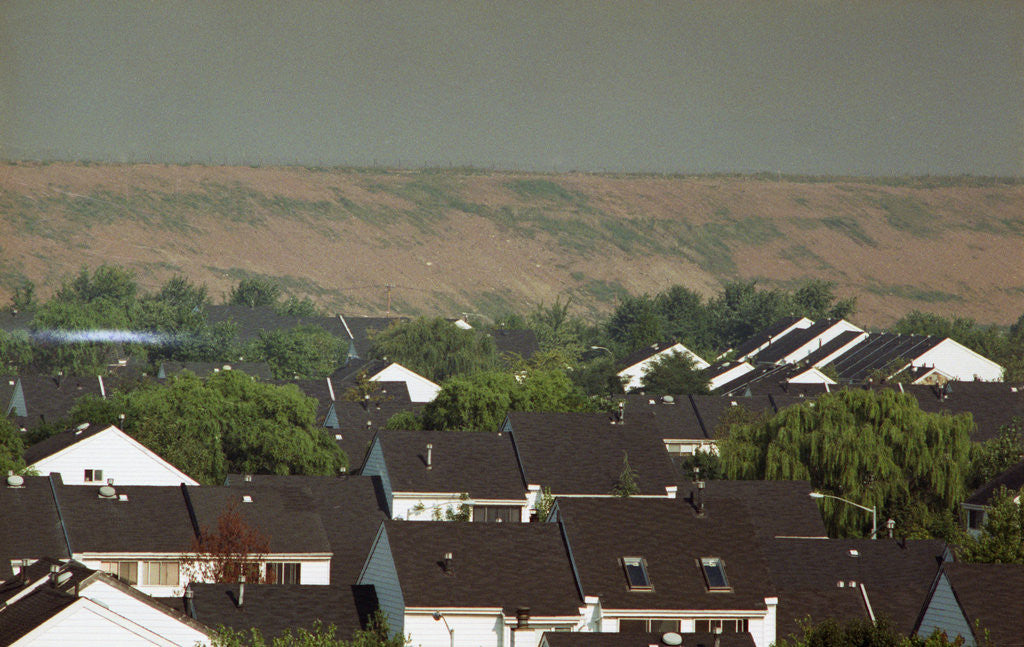 Detail of View Of Landfill Over Housing Developmen by Anonymous