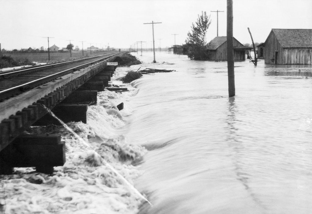 Detail of River Flood Waters Wash Around Rr Trestl by Anonymous