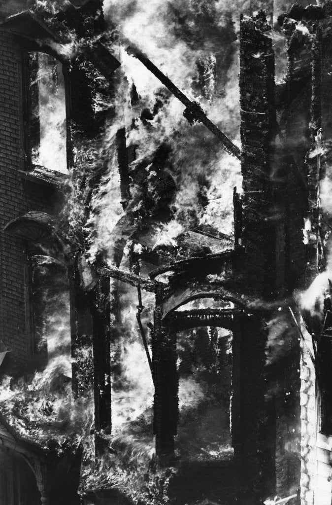 Structure Of House Engulfed In Flames by Corbis
