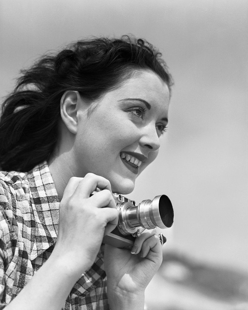 Detail of Woman Smiles as She Holds Camera by Anonymous