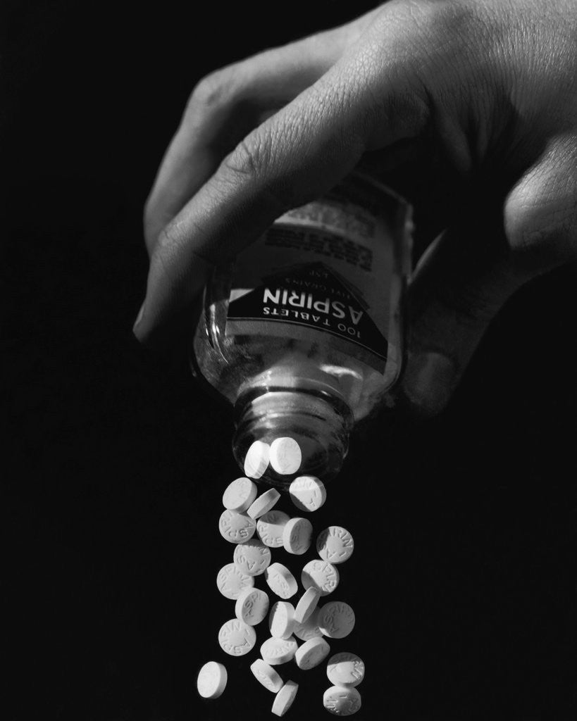 Detail of Hand Pouring Aspirin from Bottle by Corbis