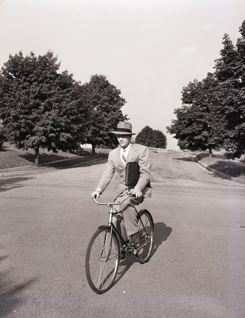 Detail of Businessman Riding a Bicycle by Corbis